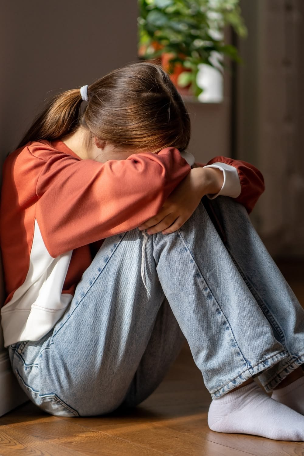Teenager avoiding a social gathering