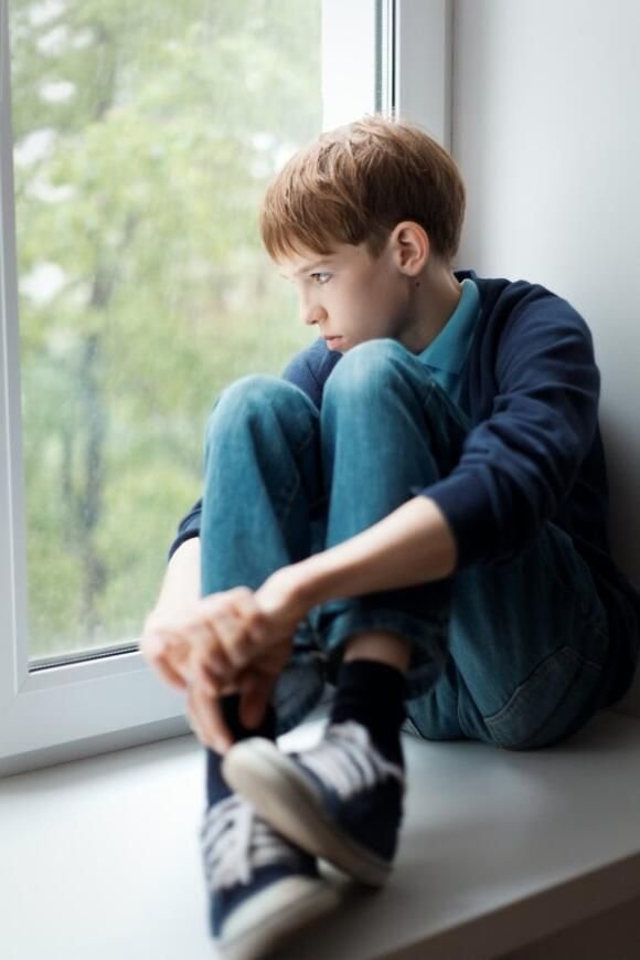 Teenager avoiding a social gathering