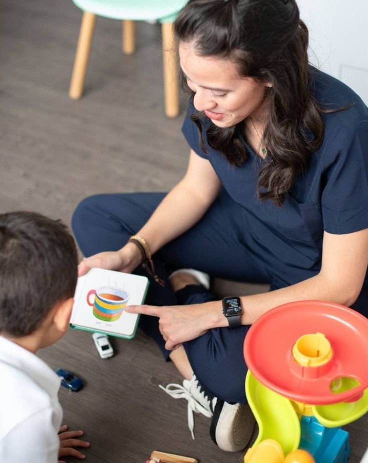 Parent and young child talking together