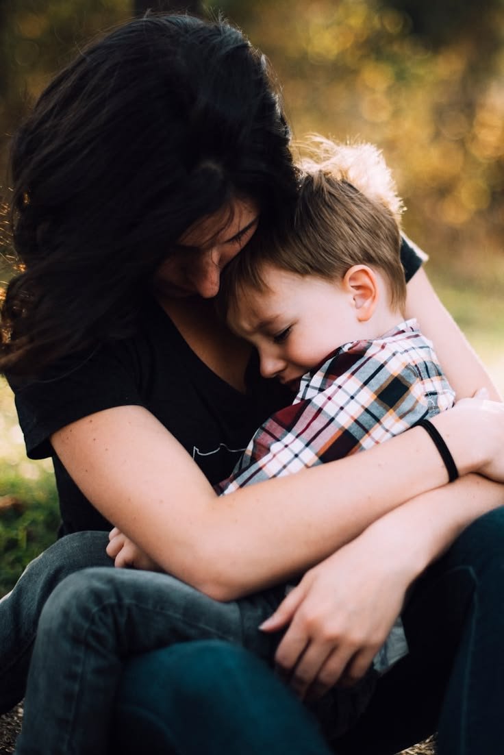 Parent and child sitting quietly together